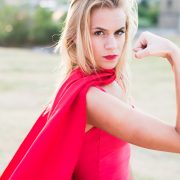 Young woman posing as superhero or wonderwoman